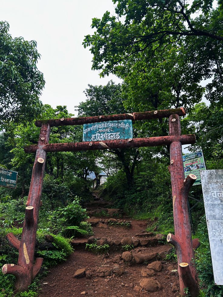 Trekkers climbing steep trail on Harishchandragad