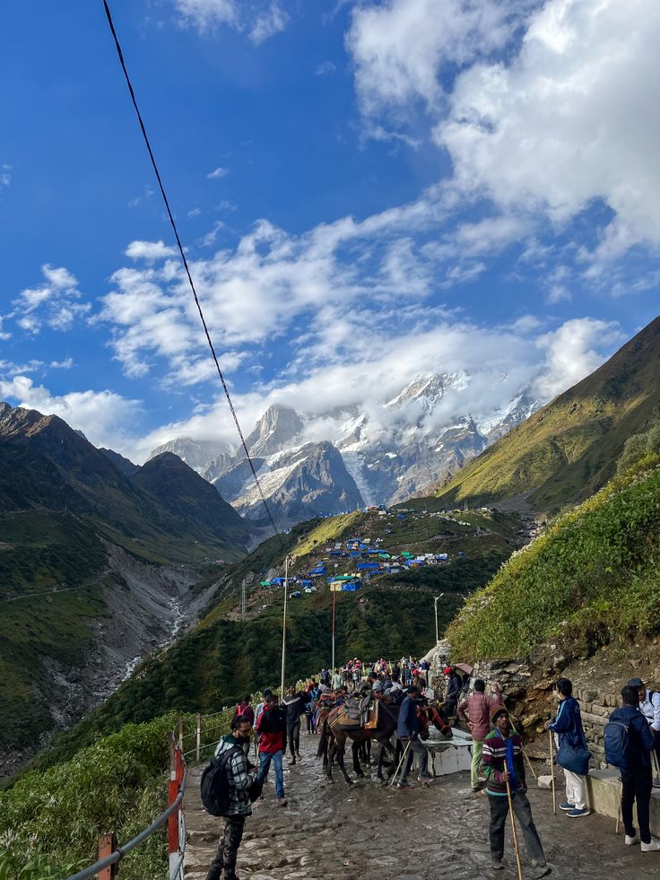 Kedarnath temple trail with trekkers walking uphill