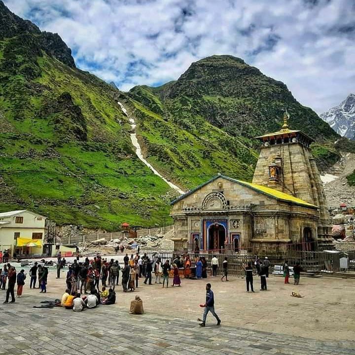 Tour manager guiding group through Chardham Yatra stops