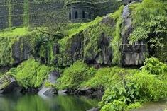 Green monsoon landscape at Raigad fort ruins
