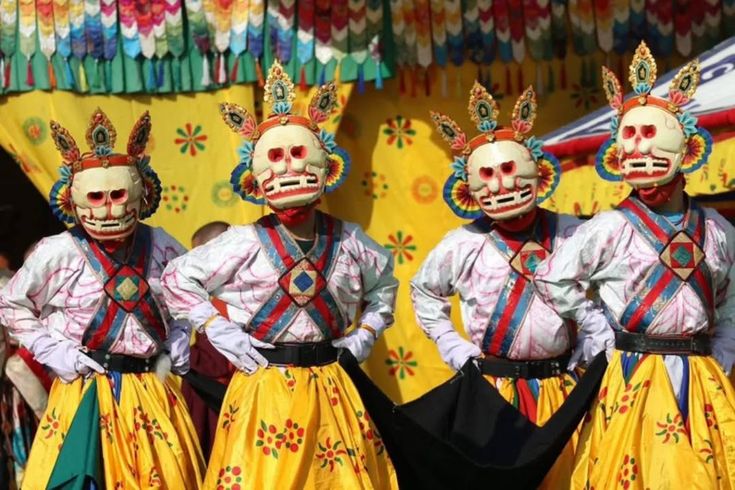 Monks in elaborate costume Paro Dzong festival