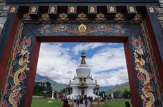 Dzong courtyard crowd Tshechu celebration Bhutan