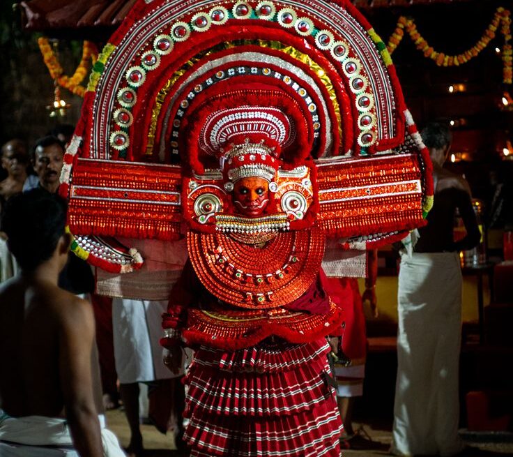 Theyyam Kerala ritual performer elaborate costume